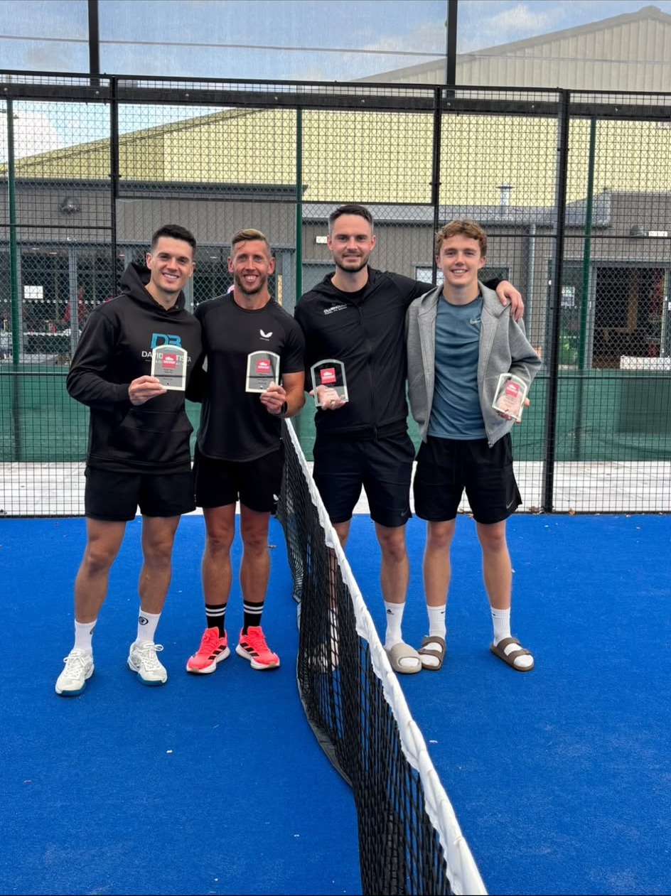 Marcus and fellow players celebrating after a padel tournament